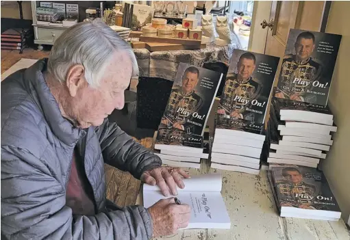  ?? COURTESY PHOTOS ?? Dubbed the world’s modern day John Philip Sousa, Col. John R. Bourgeois of Rappahanno­ck County signs copies of his new book, “Play On!” at R.H. Ballard Shop & Gallery in Washington.