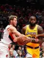  ?? AFP ?? LeBron James (right) of the Los Angeles Lakers drives against Jake Layman. —