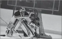  ?? STAFF PHOTOS BY MICHAEL REID ?? La Plata goalie Garrett Cherry, left, and defensemen Ryan Burroughs and Everett Cheseldine team up to thwart a scoring chance.