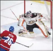  ?? Associated Press ?? SLIPPED AWAY Montreal Canadiens defenseman Jeff Petry (26) scores on Anaheim Ducks goaltender John Gibson (36) during overtime on Thursday in Montreal. The Canadiens won 3-2.