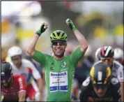  ?? Associated Press ?? UP FRONT Britain’s Mark Cavendish celebrates as he crosses the finish line to win the tenth stage of the Tour de France cycling race with start in Albertvill­e and finish in Valence, France on Tuesday.