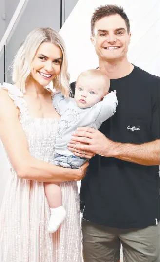  ??  ?? Supercar driver Tim Slade and Danielle Byrnes with Jordy. Picture: Tertius Pickard