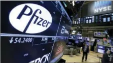  ?? RICHARD DREW — THE ASSOCIATED PRESS FILE ?? The Pfizer logo appears on a screen above its trading post on the floor of the New York Stock Exchange.