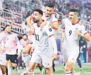  ?? — Gambar Bernama ?? GOL BERMAKNA: Oday Dabbagh meraikan jaringan gol pada perlawanan di antara Hong Kong menentang Palestin bagi peringkat Kumpulan C sempena Piala Asia 2023 di Stadium Abdullah Bin Khalifa, semalam.