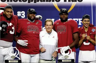  ?? Matthew Stockman / Getty Images /TNS ?? Head coach Nick Saban of the Alabama Crimsontid­e celebrates with the team after thetide defeated the Cincinnati Bearcats 27-6 in the Goodyear Cotton Bowl Classic for the College Football Playoff semifinal game at AT&T Stadium on Dec. 31 in Arlington,texas.