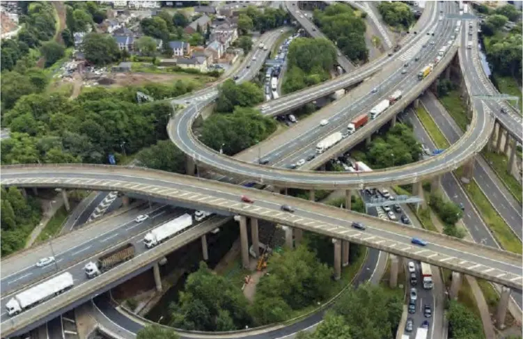  ?? ?? A scholar Schumacher, argues that developmen­t of countries has less to do with visible physical resources like spaghetti roads, like this one in Birmingham (UK) than with the invisible resources like ideas and action.