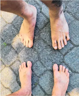  ??  ?? Pals Vini Williams and Jack Keeys are walking 100 kilometres barefoot to raise money for sports and school shoes for students here and in Africa. They are walking for five days.