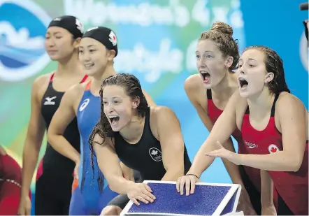  ?? — THE ASSOCIATED PRESS ?? Canada and Japan compete in a women’s 4x200-metre freestyle relay during the 2016 Rio Olympics. Swimming’s governing body wants mixed-gender relays added in the future.