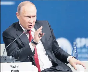  ?? AP PHOTO ?? Russian President Vladimir Putin answers a question at the St. Petersburg Internatio­nal Economic Forum in St.Petersburg, Russia, Friday.