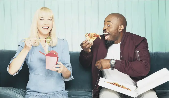  ?? PICTURE: BBC/RICOCHET/CODY BURRIDGE. ?? SLICE OF THE ACTION: Presenters Sara Cox and Darren Harriott get stuck in as the faces of new BBC series Britain’s Top Takeaways, which is filmed in Manchester.