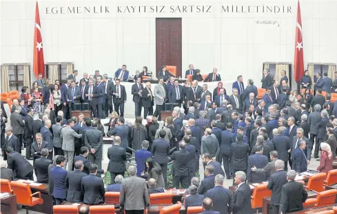  ??  ?? CHANGE-UP: Lawmakers cast their votes during the second round of a debate in the proposed changes to the Turkish constituti­on, at the Turkish parliament in Ankara yesterday.