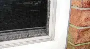  ??  ?? Force the completed storm window into the window opening as close to the primary window as possible.