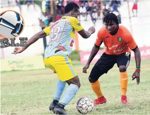  ?? SHORN HECTOR ?? Tivoli Gardens FC’s Rodico Wellington squares up with Waterhouse FC’s Cardel Benbow (right) during their clash in the Red Stripe Premier League at the Edward Seaga Complex on Sunday.