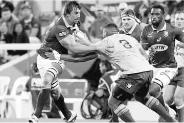  ??  ?? South Africa’s Springboks Eben Etzebeth (left) pushes off Australia’s Sekope Kepu during the Rugby Union Championsh­ip in Perth,Australia in this Sept 9 file photo. — Reuters photo