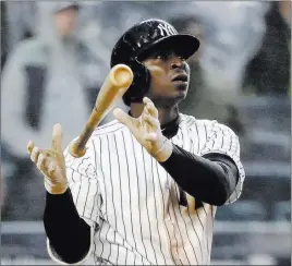  ?? Kathy Willens ?? The Associated Press New York shortstop Didi Gregorius drops the bat as he watches his three-run home run, his second of the day, in the seventh inning Tuesday at Yankee Stadium.