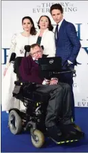  ?? The Associated Press ?? In this Dec. 9, 2014, file photo, Stephen Hawking , with actress Felicity Jones, his former wife Jane and actor Eddie Redmayne, attends the U.K. premiere of The Theory of Everything at the Odeon Leicester Square in London.