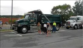  ?? PHOTOS BY NICHOLAS BUONANNO — NBUONANNO@TROYRECORD.COM ?? Over 20 different kinds of trucks were on display in the Maple Avenue Middle School parking lot.