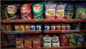  ?? JUSTIN SULLIVAN, GETTY IMAGES ?? Frito-Lay has been looking for ways to get into the natural foods aisles.