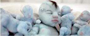  ??  ?? Silicone models depicting babies from the Avatar feature film are displayed at the Bilbao Reborn Doll Show, a trade fair featuring hyperreali­st silicone and vinyl babies, known as 'Reborns', in Bilbao, northern Spain, June 11, 2017. REUTERS/ Vincent West