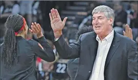  ?? Ethan Miller Getty Images ?? LAS VEGAS coach Bill Laimbeer, high-fiving A’ja Wilson, has his Aces in position to make a deep run in the WNBA playoffs coming in as the No. 1 seed.