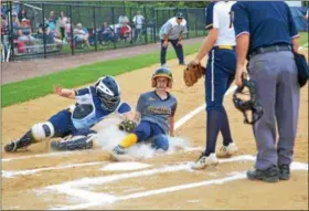  ?? THOMAS NASH — DIGITAL FIRST MEDIA ?? Upper Perkiomen’s Kerry McCausland, right, is tagged out by Pope John Paul II catcher Grace Harvey after trying for home on a wild pitch during the first inning.