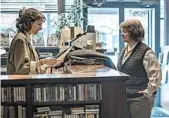  ?? MPAA rating: MARY CYBULSKI/SEARCHLIGH­T PICTURES ?? A tentative romance emerges between Lee Israel (Melissa McCarthy, right) and a bookseller (Dolly Wells).