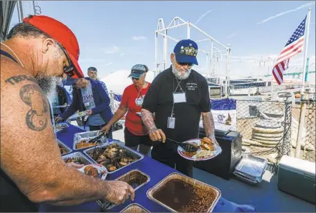  ?? Irfan Khan Los Angeles Times ?? AT ITS PEAK, the Iowa Picnic once attracted 125,000 people. This year’s event drew about 160 aboard the battleship Iowa in San Pedro.