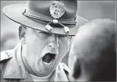  ?? Mark Boster Los Angeles Times ?? SHERIFF’S DEPUTY Guillermo Garcia gets in the face of a recruit on the first day of training.