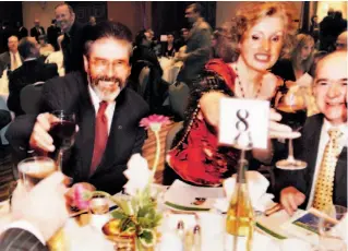  ?? RICK MADONIK/TORONTO STAR ?? Sinn Fein president Gerry Adams toasts his tablemates with a glass of wine prior to addressing the annual dinner of the Friends of Sinn Fein ( Canada) at Toronto’s Hilton hotel last night.