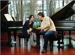  ?? (Special to the Democrat-Gazette) ?? Husband and wife piano duo Jaeyeon Park (left) and Naoki Hakutani perform for the Little Rock Musical Coterie on Sunday at Little Rock’s Pulaski Heights United Methodist Church.