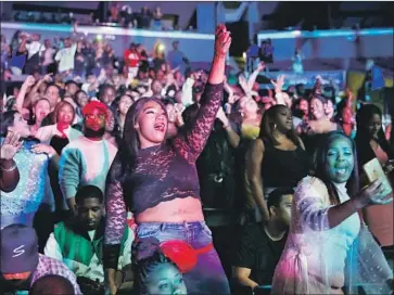  ?? Photograph­s by Mel Melcon Los Angeles Times ?? BIG NAMES attracted crowds, such as this one for Chris Brown, but no sell-outs, to the BET Experience.