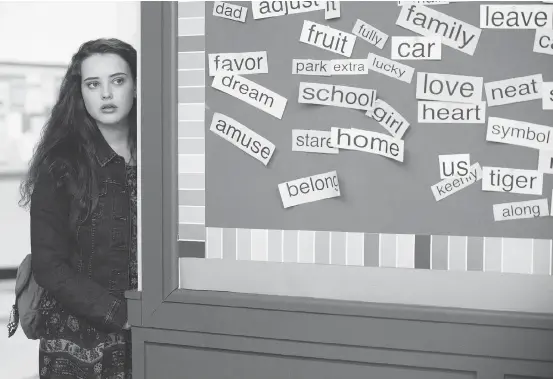 ?? BETHDUBBER/NETFLIXVIA­AP ?? Katherine Langford in a scene from the controvers­ial series 13 Reasons Why, about a teenager who commits suicide.