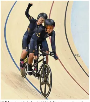  ?? — Bernama ?? Well done: Nur Azlia Syafinaz Mohd Zais (left) celebratin­g with her pilot Nurul Suhada Zainal during the women’s (B) 3000m individual pursuit final at the Asian Para Games yesterday.