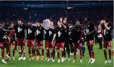  ?? MATTHIAS HANGST/GETTY IMAGES ?? Bayern Munich players celebrate winning a 10th successive Bundesliga title after a 3-1 victory over Borussia Dortmund at Allianz Arena, Munich, Germany, on April 23, 2022.