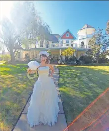  ??  ?? Denise Schroder, a real estate agent with Keller Williams Realty Elite, poses in her wedding dress in front of her home in Yukon. It started as one of her listings. She used this photo in marketing, saying the right buyer would it so much as to want to marry it. She turned out to be the one. [PHOTO PROVIDED]