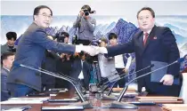  ?? REUTERS ?? NORTH KOREA’s Ri Son Gwon, chairman of the Committee for the Peaceful Reunificat­ion of the Country, shakes hands with South Korean Unificatio­n Minister Cho Myoung-gyon after exchanging the joint statement during their meeting at the truce village of Panmunjom inside the demilitari­zed zone, South Korea in this Oct. 15 photo.