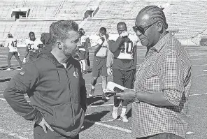  ?? USA TODAY SPORTS ?? Jarrett Bell speaks with Rams coach Sean McVay during a Super Bowl week practice.
