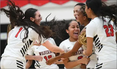  ?? PHOTO BY ANDY HOLZMAN ?? Harvard-Westlake players celebrate after defeating Notre Dame in the CIF Southern California regional Division II title game on Tuesday night.