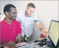  ?? CP PHOTO ?? Motorleaf chief executive and co-founder Alastair Monk, right, works with Adama Diallo at the company’s office June 13 in Montreal.