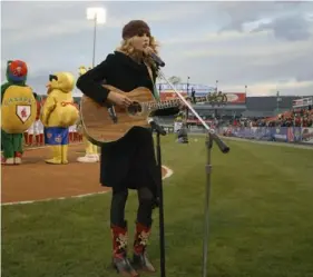  ?? Reading Fightin’ Phils via AP ?? Taylor Swift sings the national anthem before a Reading Fightin’ Phils minor league baseball game on April 5, 2007, at First Energy Stadium in Reading.