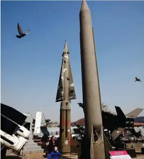  ??  ?? War relics: Visitors admiring decommissi­oned weapons at the Korea War Memorial Museum in Seoul yesterday as South Korea started its military drills near its disputed sea boundary with North Korea. — EPA