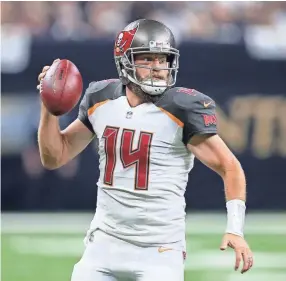  ??  ?? Buccaneers quarterbac­k Ryan Fitzpatric­k looks to pass against the Saints on Sunday. Fitzpatric­k accounted for five touchdowns in the game. CHUCK COOK/USA TODAY