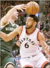  ?? The Canadian Press ?? Milwaukee Bucks guard Matthew Dellavedov­a moves the ball past Toronto Raptors guard Cory Joseph during second half NBA playoff basketball action in Toronto on Tuesday.
