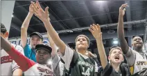  ??  ?? Young sneaker enthusiast­s react to “CJ so Cool” challengin­g the Sneaker Con crowd to a game of one-on-one.