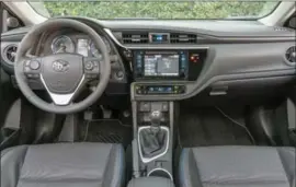  ??  ?? The Corolla’s interior is well organized, its centrepiec­e a seven-inch touchscree­n display in the middle of the dashboard. The SofText seats are comfy and offer good support – and look great to boot!