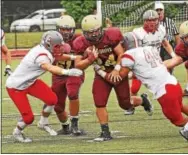  ?? CHRIS BARBER — DIGITAL FIRST MEDIA ?? West Chester East’s Matt Erfle makes a stop on Avon Grove running back Kevin Francis on Saturday.