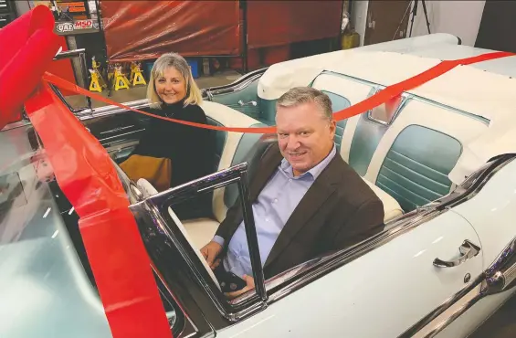  ?? PHOTOS: ALYN EDWARDS/ DRIVING ?? Susie and Pat Lauro show off their freshly restored 1958 Pontiac Parisienne that was bought new by Susie's late uncle and inherited by her.