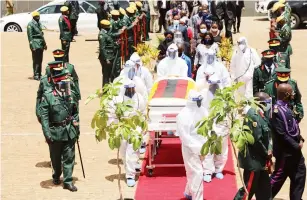  ?? — Picture: John Manzongo ?? Pallbearer­s carry the casket of National Hero Brigadier-General Collin Moyo (Retired) at the National Heroes Acre in Harare yesterday.