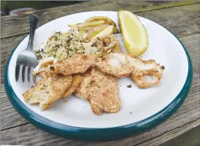  ?? NWA Democrat-Gazette photograph by Flip Putthoff ?? Crispy baked crappie filets is a tasty treat that’s simple to make. The recipe is delicious using other kinds of fish including walleye and black bass.
