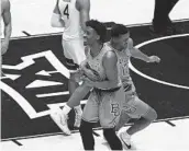  ?? KATHY BATTEN AP ?? Baylor’s Adam Flagler and Jared Butler (12) celebrate the team’s win over West Virginia, Big 12 title.